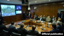 Italy - Italian Defense Minister Roberta Pinotti (R) and Armenian President Serzh Sarkisian hold a video conference with Armenian soldiers serving in Lebanon under Italian command, Rome, 9Apr2015.