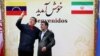 Venezuelan President Hugo Chavez (left) being welcomed at the presidential palace in Tehran by Iranian President Mahmud Ahmadinejad in 2010.