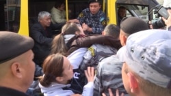 Dramatic Scenes As Kazakh Police Seize Teenager