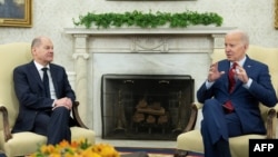 U.S. President Joe Biden (left) made his remarks at a meeting in Washington with German Chancellor Olaf Scholz. (file photo)