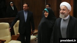 Iranian Vice President for Women's Affairs Masoumeh Ebtekar (center) recently attended a cabinet meeting and sat a few seats away from President Hassan Rohani (right). 