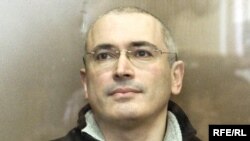 Mikhail Khodorkovsky sits inside the bulletproof defendents' cage of a Moscow court on March 3.