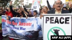 Pakistanis attend a peace rally in Lahore on February 2019 to protest against the escalating tensions between nuclear-armed rivals India and Pakistan.