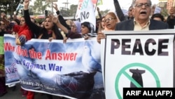 Amid heightened tensions with India, Pakistani civil society activists march in a peace rally in Lahore on February 28. 