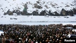 Afghan villagers perform funeral prayers for avalanche victims in Panjshir Province on February 26. 