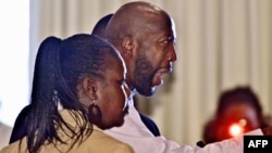 The family of Trayvon Martin speak before the City of Sanford commissioners, in Sanford, Florida on March 26 