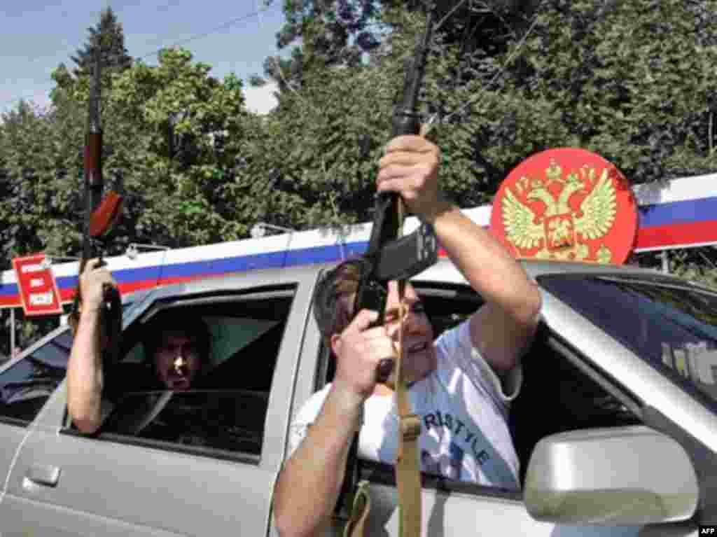 South Ossetian men celebrate the recognition of South Ossetia in Tskhinvali - GEORGIA, TSKHINVALI : South Ossetian men shoot in the air as they celebrate the recognition of the South Ossetian independence by the Russian Federation on August 26 in Tskhinvali. Russia on August 26, 2008 formally recognised the Georgian rebel regions of South Ossetia and Abkhazia as independent states in a startling new challenge to the West.