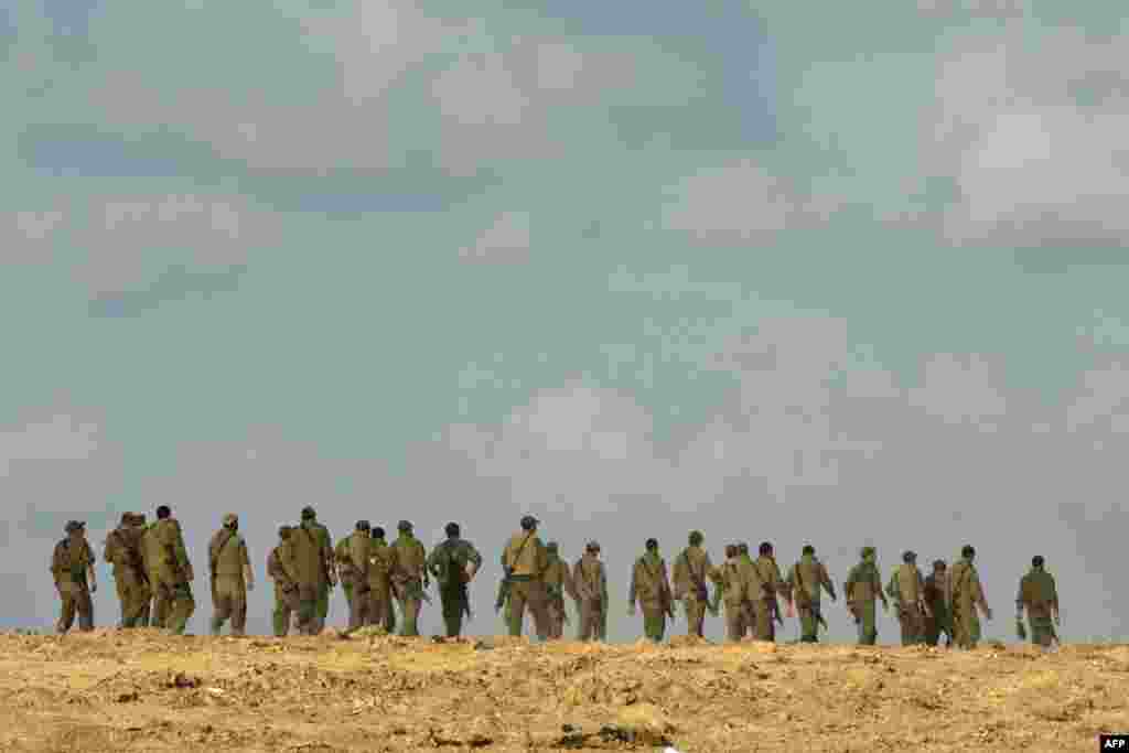 Israeli soldiers line up as part of an army deployment near the Israel-Gaza Strip border. (AFP/Jack Guez)