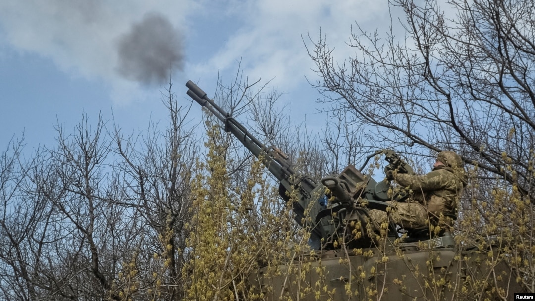A Ukrainian serviceman fires an anti-aircraft cannon near the frontline city of Bakhmut on April 7. 