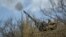 A Ukrainian serviceman fires an anti-aircraft cannon near the frontline city of Bakhmut on April 7. 