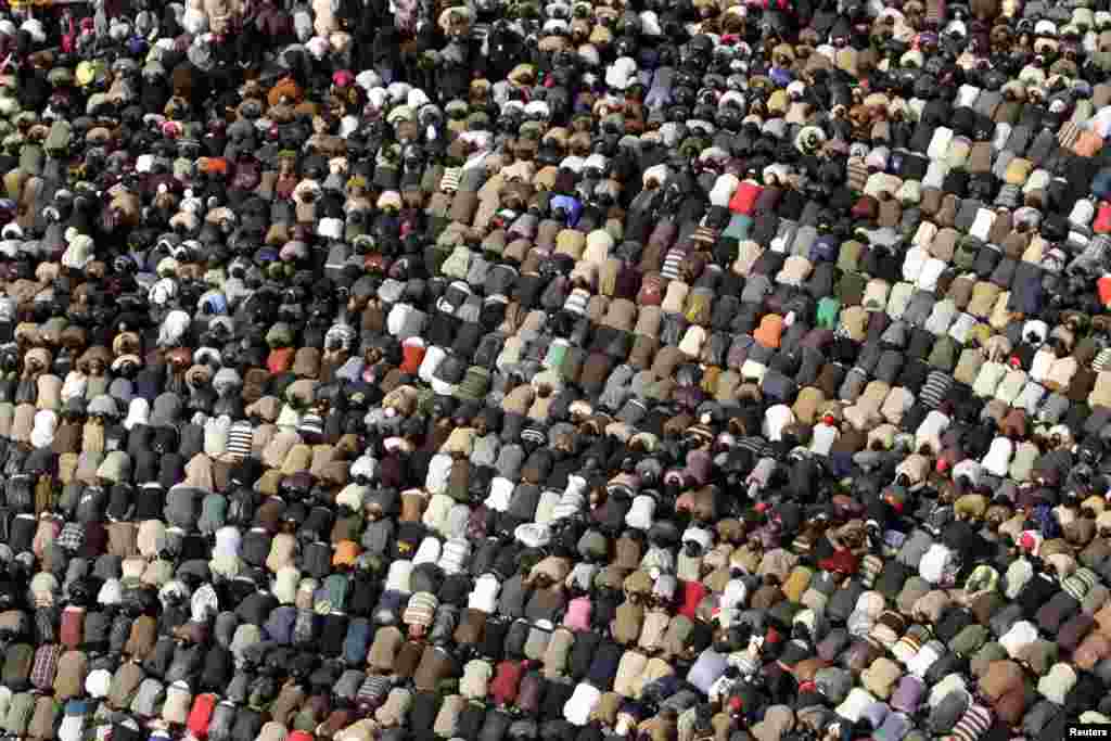 Opposition supporters attend Friday Prayers on Tahrir Square on February 11, 2011.