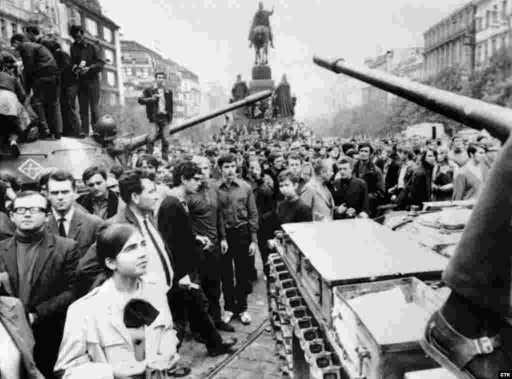 Soviet tanks are surrounded by crowds of Czechs protesting against the invasion on Prague&#39;s Wenceslas Square on August 21, 1968.