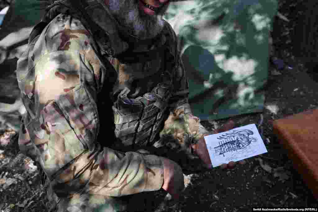 A member of an artillery crew near Pokrovsk shows the religious artwork he sketches between combat duties.&nbsp; Pokrovsk is a major railway hub and, crucially, produces high-quality coal needed in steel production. Industry experts say Ukraine could lose half of its current steelmaking capacity if the city and its nearby mine falls into Russian hands. &nbsp;