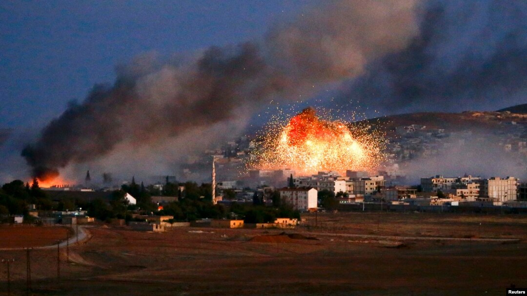 Smoke and flames rise over the Syrian town of Kobani after an air strike by a U.S.-led coalition on October 20.