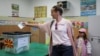 A woman votes in the presidential election at a school in Skopje on April 24.