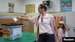 A woman votes in the presidential election at a school in Skopje on April 24.