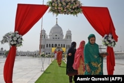 Sikh pilgrims arrive to take part in a religious ritual on the occasion of the 481st death anniversary of Baba Guru Nanak Dev Ji, the founder of Sikhism, at the Gurdwara Darbar Sahib in Kartarpur near the India-Pakistan border in Punjab in September 2020.