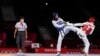 Kimia Alizadeh (left) in action during her first-round victory over compatriot Nahid Kiyani in the taekwondo women's under-57-kilogram competition at the Tokyo Olympics. She eventually made it to the semifinal stage, just missing out on emulating her bronze-medal finish at the 2016 games when she became the first Iranian woman to win an Olympic medal. 