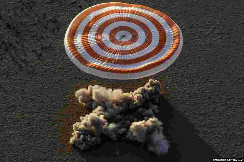 Russia&#39;s Soyuz MS-04 space capsule carrying the International Space Station crew of Russian cosmonaut Fyodor Yurchikhin and U.S. astronauts Peggy Annette Whitson and Jack Fischer lands in a remote area outside the town of Zhezkazgan, Kazakhstan. (AFP/Sergei Ilnitsky)