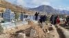 Families of protesters killed in the city of Marivan attending the burial ceremony of 7 victims on November 20, 2019.