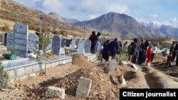 Families of protesters killed in the city of Marivan attending the burial ceremony of 7 victims on November 20, 2019.