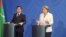 German Chancellor Angela Merkel (right) with Turkmen President Gurbanguly Berdymukhammedov in Berlin on August 29.