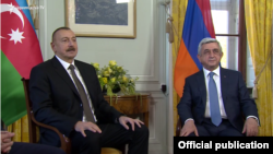 Azerbaijan's Ilham Aliev (left) and Armenia's Serzh Sarkisian meet in Geneva on October 16.