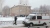 A vehicle from the Russian Emergencies Ministry stands parked near a local school in Perm after two assailants wearing masks injured schoolchildren and a teacher with knives on January 15. 