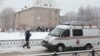 A vehicle from the Russian Emergencies Ministry is parked near the school in Perm after reports of a serious knife fight.