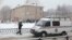 A vehicle from the Russian Emergencies Ministry is parked near the school in Perm after reports of a serious knife fight.