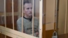 Uladzislau Kazakevich sits in court during his more recent trial last month.