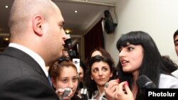 Armenia - Education Minister Armen Ashotian (L) is confronted by students at Yerevan State Linguistic University prtesting against the dismissal of its rector Suren Zolian, 19Apr2012.