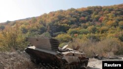 NAGORNO-KARABAKH -- A destroyed infantry fighting vehicle is seen on the road during the military conflict in Nagorno-Karabakh, October 15, 2020