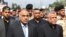 Iraq's Prime Minister Adel Abdel Mahdi (L) and Hadi al-Ameri, leader of the mostly Shiite Hashed al-Shaabi paramilitary units, attend a symbolic funeral ceremony in Baghdad on October 23, 2019 (Photo by AHMAD AL-RUBAYE / AFP)