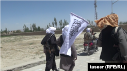 FILE: Taliban fighters in the central Afghan province of Ghazni.