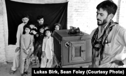 Izzat Ullah taking a family photograph in Peshawar, Pakistan, in 2012.