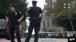 Members of U.S. law-enforcement agencies investigate the scene following a late-night explosion in New York.