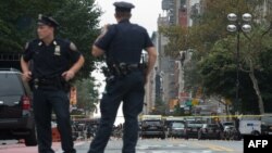 Members of U.S. law-enforcement agencies investigate the scene following a late-night explosion in New York. 