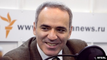 Former World Chess Champion, Garry Kasparov, right, talks to the