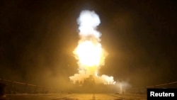 Photo released by US Central Command shows explosions at an unnamed location on July 11-12