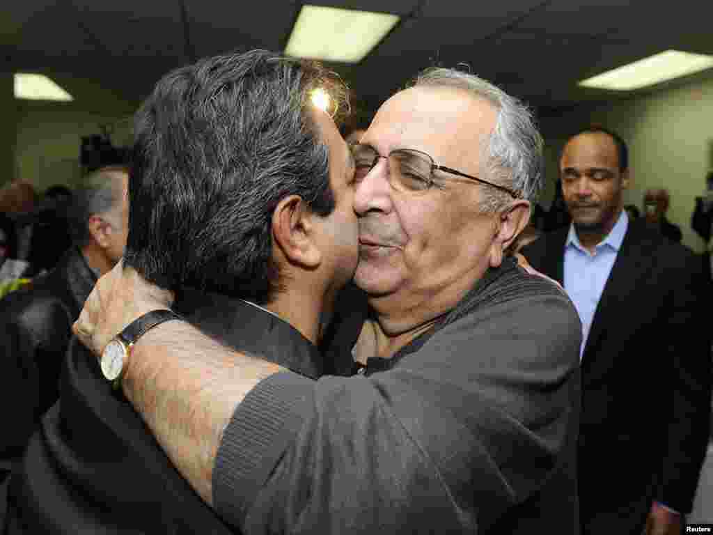 Iranian-American businessman Reza Taghavi is greeted by family and friends in Los Angeles after his release from prison in Iran. He was held for more than two years on suspicions that he sent funds to an outlawed group in Iran. Photo by Phil McCarten for Reuters