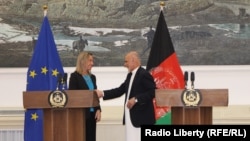 European Union foreign policy chief Federica Mogherini (left) shaking hands with the Afghan President Ashraf Ghani during a press conference at the presidential palace in Kabul on March 26.