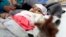 A Yemeni infant suspected of being infected with cholera receives treatment at a hospital in Sanaa, on June 13, 2017. 