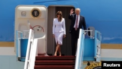 U.S. President Donald Trump and first lady Melania Trump wave upon their arrival in Tel Aviv, Israel, on May 22. 