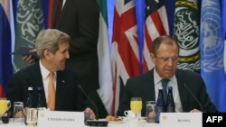 Talking Syria -- U.S. Secretary of State John Kerry and Russian Foreign Minister Sergei Lavrov in New York on December 18.