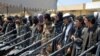 Members of Islamic State hand over their weapons to the Afghan forces during a ceremony in Jawzjan Afghanistan on August 2.