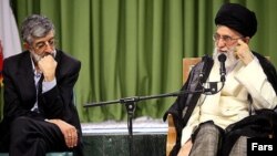 Prominent Iranian politician Gholamali Haddad Adel and Supreme leader Ali Khamenei. Haddad Adel's son says he has contracted coronavirus. FILE PHOTO