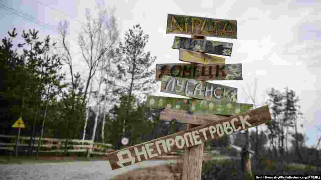 Signs of the children&#39;s home towns at the camp, which is called &ldquo;Lisova zastava&rdquo; (&ldquo;Forest Outpost&rdquo;)