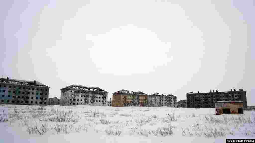 Abandoned buildings in Vorkuta city, near the Vorkuta River