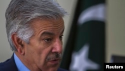 Defense Minister Khawaja Asif speaks during an interview with Reuters at his office in Islamabad, March 6, 2014